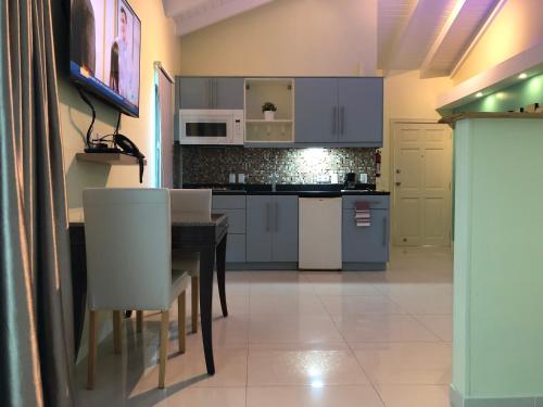 Η κουζίνα ή μικρή κουζίνα στο Quints Travelers Inn
