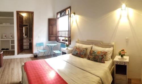 Ένα ή περισσότερα κρεβάτια σε δωμάτιο στο Casa Ensueño Hogar Boutique
