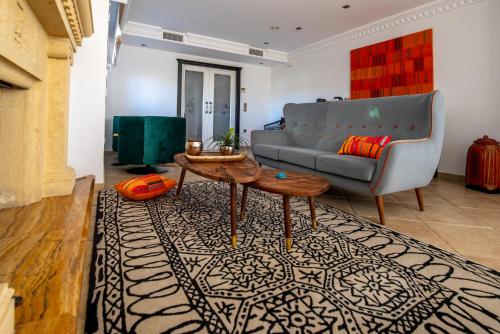 a living room with a couch and a table at La Rayuela in Monachil