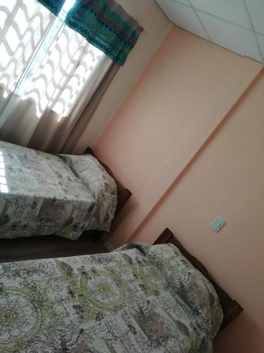 Postel nebo postele na pokoji v ubytování Nijulu