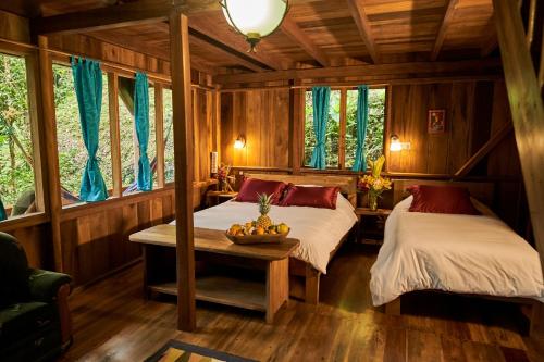 Postel nebo postele na pokoji v ubytování Casa Divina Eco Lodge