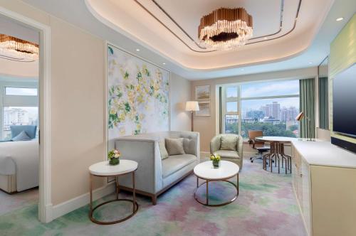 a living room with a couch and a table at Radisson Collection Hotel, Xing Guo Shanghai in Shanghai