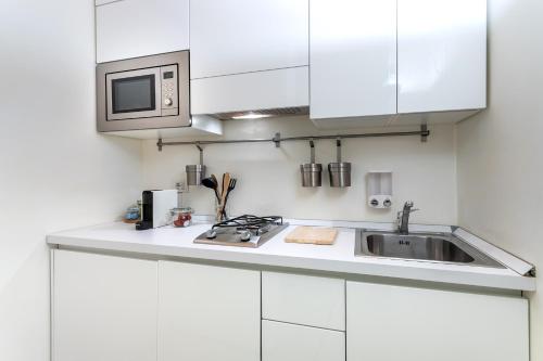 A kitchen or kitchenette at [DESIGN LOFT] Walking distance Brera-Duomo with Wifi+Netflix