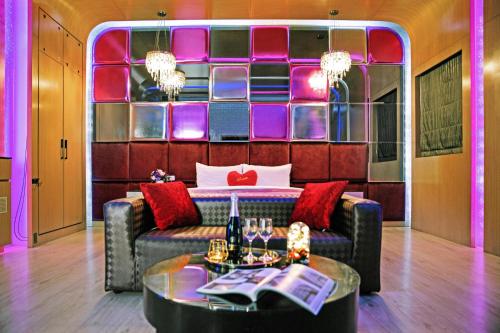 a living room with a couch and a table at Affair motel Co.Ltd in Wuqi