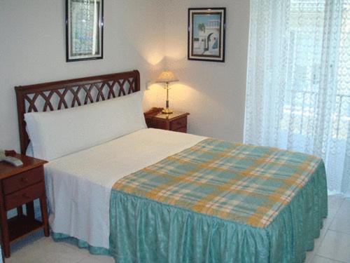 Säng eller sängar i ett rum på Hostal Villamañez