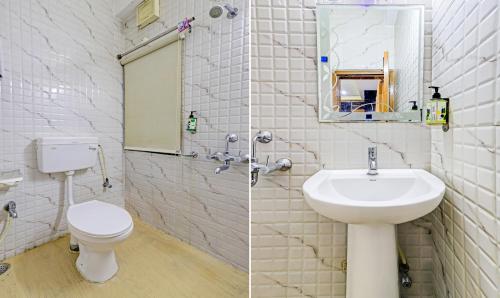 a bathroom with a sink and a toilet and a mirror at Treebo Umal Homestay Ganeshguri in Guwahati