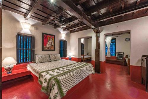 a bedroom with a bed in a room at SaffronStays Suvarna Sangam, Udupi in Udupi