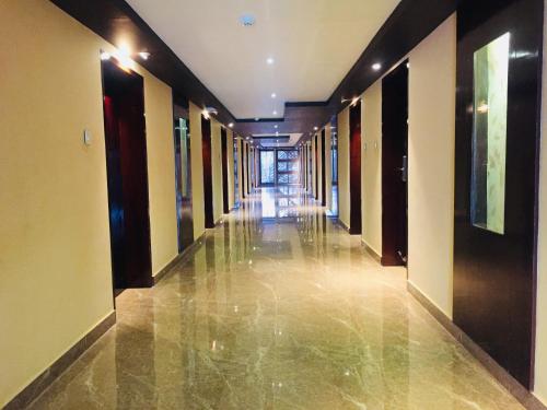 a hallway of a building with a long corridor at Hotel Lance International in Nāgercoil