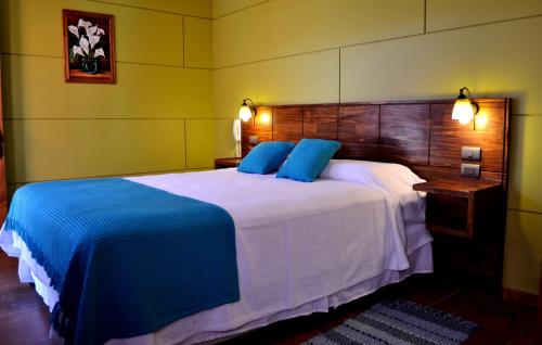 Hotel Cumbres de Atacama tesisinde bir odada yatak veya yataklar
