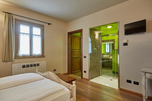 Postel nebo postele na pokoji v ubytování Agriturismo Alba Del Borgo