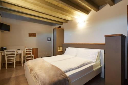Postel nebo postele na pokoji v ubytování Agriturismo Alba Del Borgo