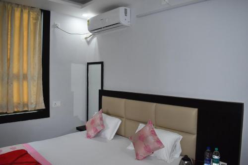 Postel nebo postele na pokoji v ubytování Bodhi Stay