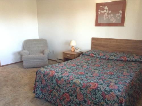 Postel nebo postele na pokoji v ubytování Downtown Motel