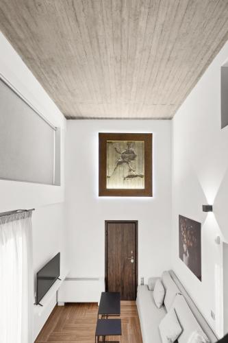 a living room with a couch and a table at ATHENIAN VIEW LOFT in Athens