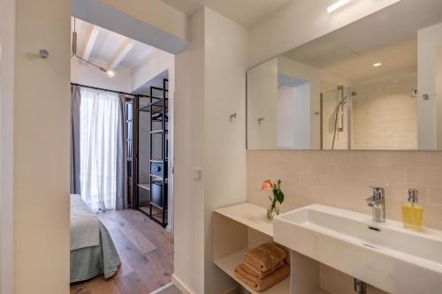 a bathroom with a sink and a mirror at Ca’s Cuscanti in Sóller