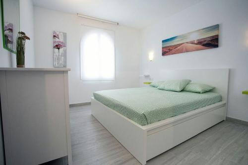Postel nebo postele na pokoji v ubytování Vivienda Vacacional Erido