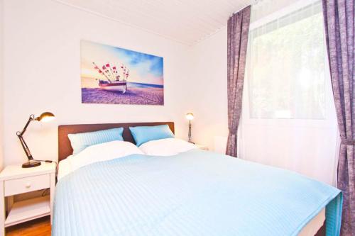 Ένα ή περισσότερα κρεβάτια σε δωμάτιο στο Gronenberger Mühle Haus 03