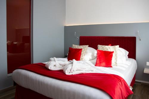 Cama o camas de una habitación en Colmar Hotel