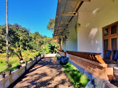 a view from the porch of a house at Wild Mist Homestay in Munnar