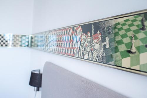 a painting on a wall in a room at La Rayuela in Monachil