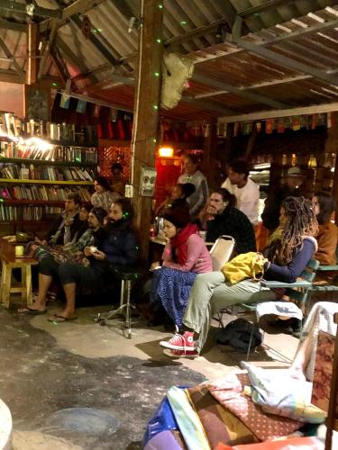 a group of people sitting in a book store at Good Life Dacha Wellness Homestay in Pai