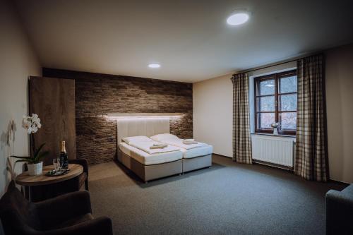 a bedroom with a bed and a window at Pod Slamníkem in Dolní Morava