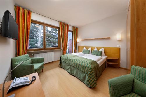 Ένα ή περισσότερα κρεβάτια σε δωμάτιο στο Hapimag Apartments Meran
