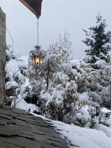 a light on top of a roof in the snow at Micro-lodge, Jardin Secret in Montriond