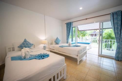 Postel nebo postele na pokoji v ubytování Assava Dive Resort - SHA Plus