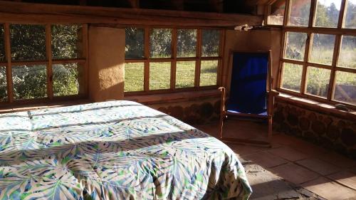 Un pat sau paturi într-o cameră la Chalet Casa de Teja