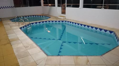 Bazén v ubytování Hotel Chalés Terra Nova nebo v jeho okolí