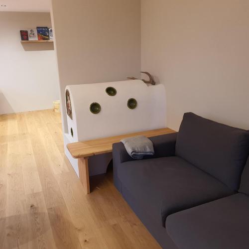 a living room with a couch and a table at Bergchalet Prantach in San Martino