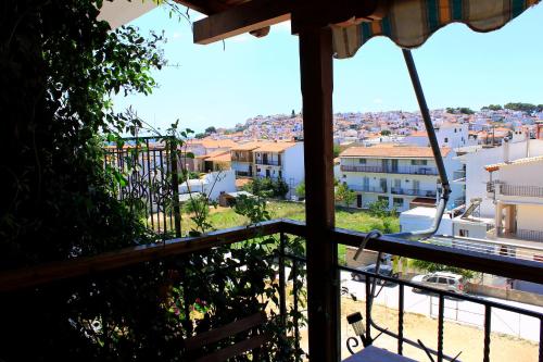 a view of a city from the balcony of a house at Vaya Zorba Studios in Skiathos Town