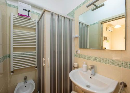 a bathroom with a sink and a mirror at Agriturismo Dea Cerere in Carovigno