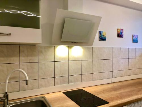 a kitchen with a sink and a counter top at Old Town Romantic Apartment. Breslau-Wroclaw. in Wrocław