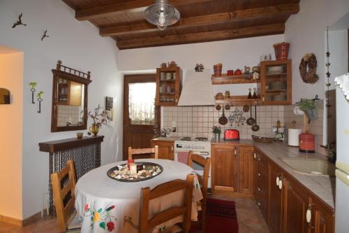 a kitchen with a table with a candle on it at St. John Traditional House in Áyios Ioánnis