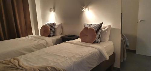 a person with their feet up on a bed at HD Mogán Canal Apartments in Puerto de Mogán
