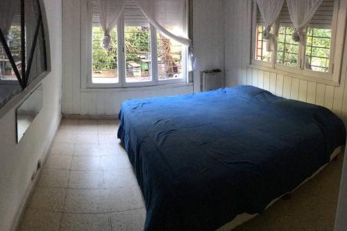 Una cama o camas en una habitación de Baqueano surf house