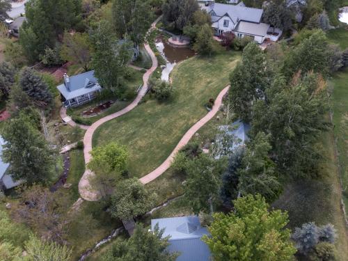 an aerial view of a house with a driveway at Apple Orchard Inn in Durango