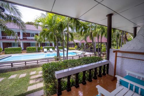 a view of the pool from the balcony of a resort at Assava Dive Resort - SHA Plus in Koh Tao