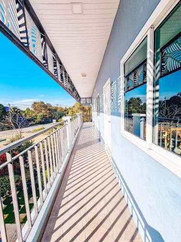 a balcony with a view of the ocean at APA-TREE Boutique Hotel in Natai Beach