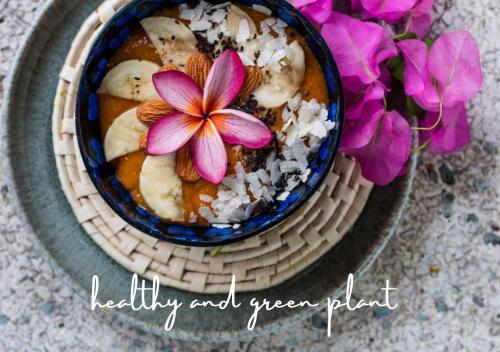 a bowl of food with a purple flower in it at Trinco Beach by DSK in Trincomalee