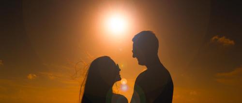a silhouette of a couple looking at the sunset at Sky Beach Maldives - Dhiffushi in Dhiffushi