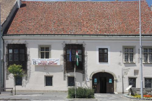 a white building with a red roof at Aqua Hotel Termál in Mosonmagyaróvár