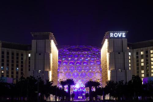 a building that is lit up at night at Rove Expo City in Dubai