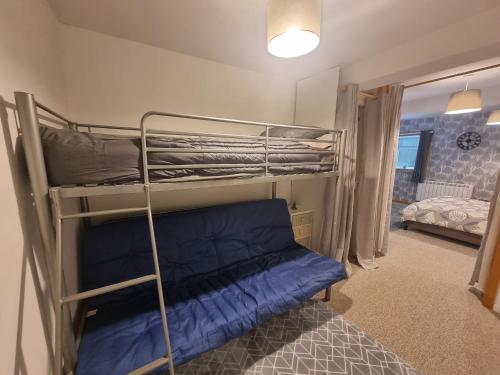 a bunk bed in a room with a bunk bedutenewayewayangering at Two Bedroom Barn Conversion in Newquay