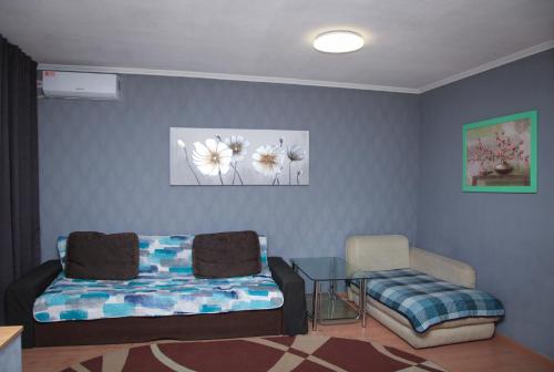 En eller flere senge i et værelse på Apartment Pushkina