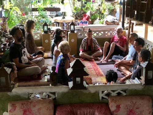 a group of people sitting in a meditation room at Good Life Dacha Wellness Homestay in Pai