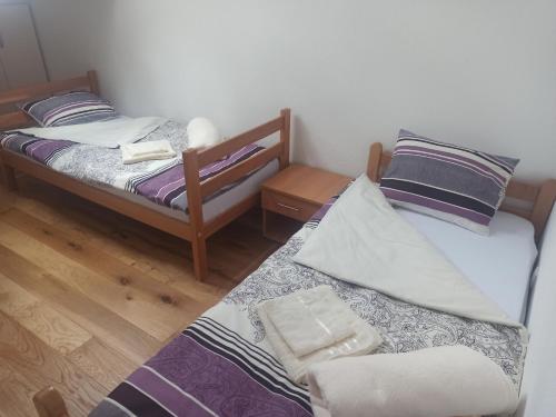 Giường trong phòng chung tại Apartman Sky Banja Vrujci