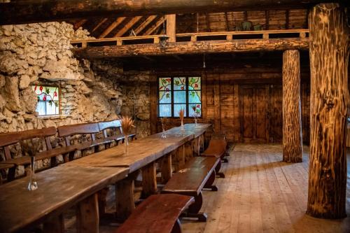 a large room with wooden benches in a building at Resort Jura in Kroczyce